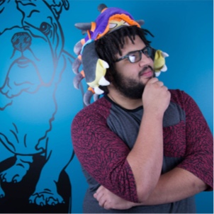 Rover employee wearing a funny colorful hat with a blue background that has an english bulldog drawn in it.