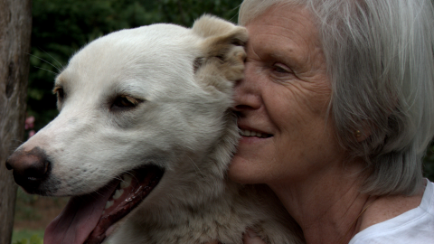 Woman with her dog - when is okay to euthanize a pet