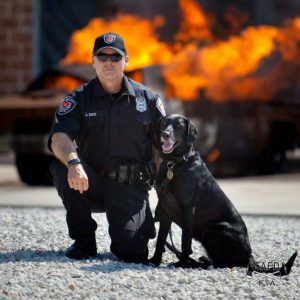 An arson dog and her handler, via State Farm