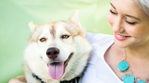 woman holding a husky hearts aligned study