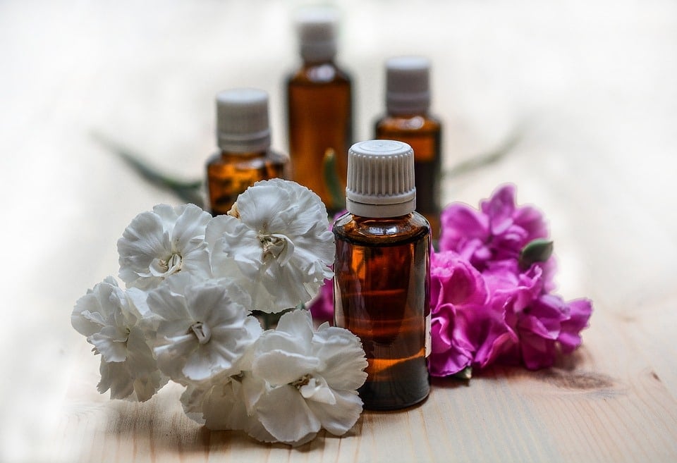 Essential oil bottles with flowers