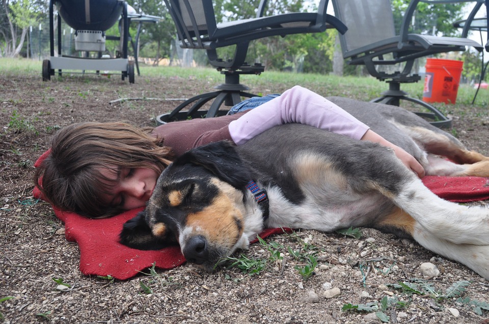 girl and dog sleeping