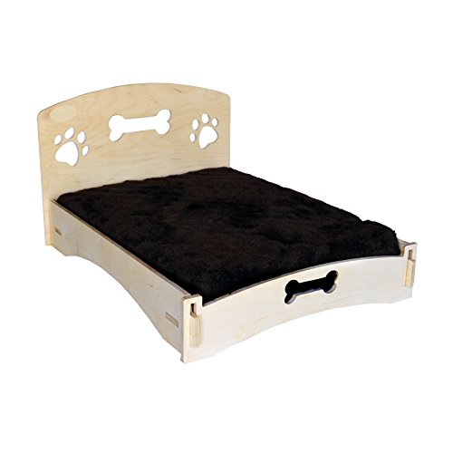 wood-framed dog bed with a headboard with paw and bone cutout design
