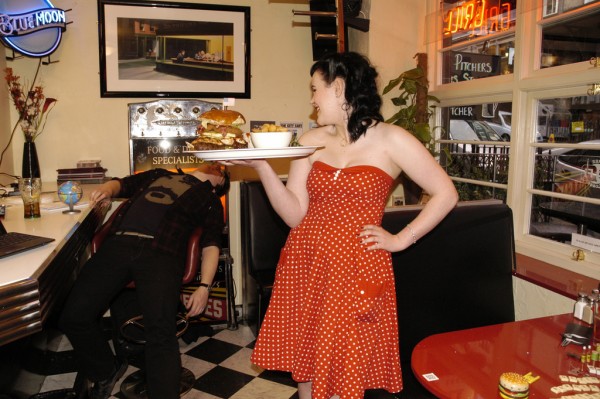 1940s woman dressed in red serving at the Diner: DogBuddy's dog-friendly coffee shops in Edinburgh