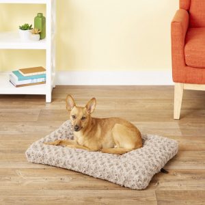 dog lounging on Midwest swirl dog crate mat