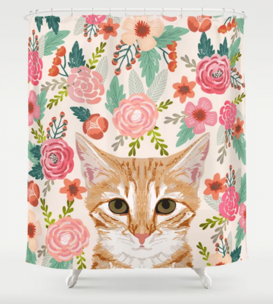 orange tabby and floral shower curtain