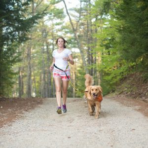 woman running with dog on Kurgo Quantum hands-free leash