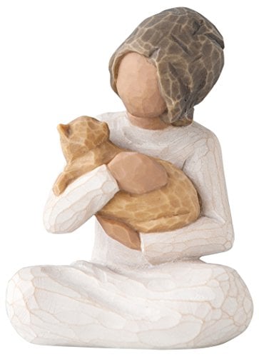 wooden figurine, woman holding orange cat