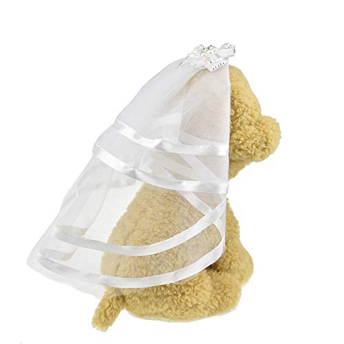 white bridal veil outfit with bow on top on stuffed toy dog's head for wedding