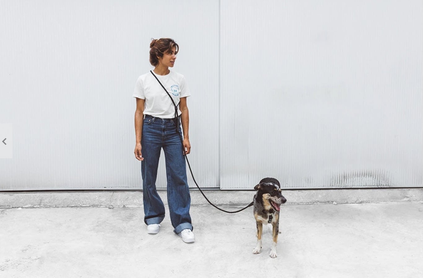 Woman walking a dog with a hands free leash