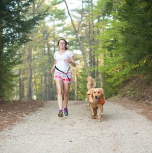 woman running with dog on Kurgo Quantum nylon reflective hands-free leash