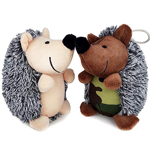 two plush hedgehog toys facing each other, one cream colored, one brown with a camouflage tummy
