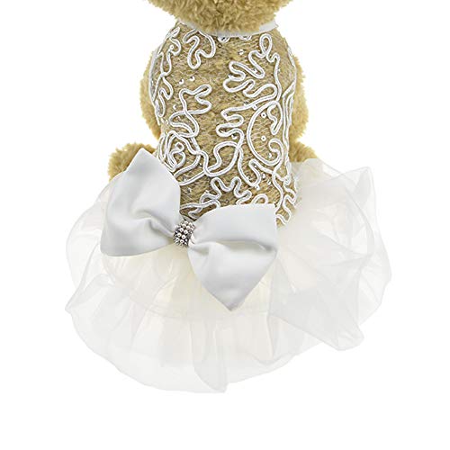 toy dog wearing lace back wedding outfit with tulle skirt and pearl detail on bow