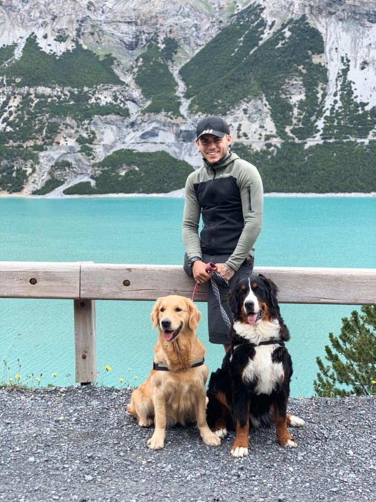 Andrea Pusateri with his Golden Retriever, Maya, and Bernese Mountain Dog, Sally.