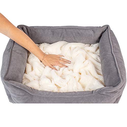 Hand pats plush dog bed with fleece blanket
