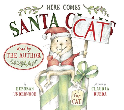 Book featuring illustrated cat sitting on present: "Here Comes Santa Cat"