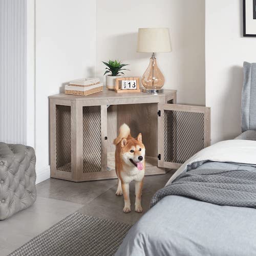 A Shiba stands in front of an open Unipaws corner crate