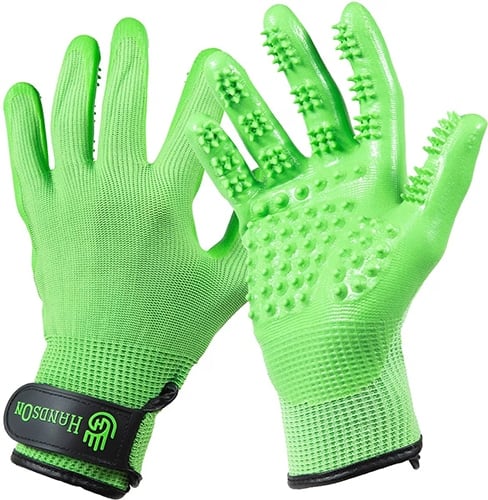 Bright green gloves with rubber nubs to help brush double-coated dogs