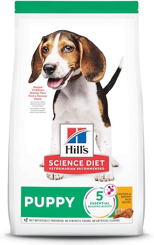 A green and white bag of Hill's Science Diet puppy food.
