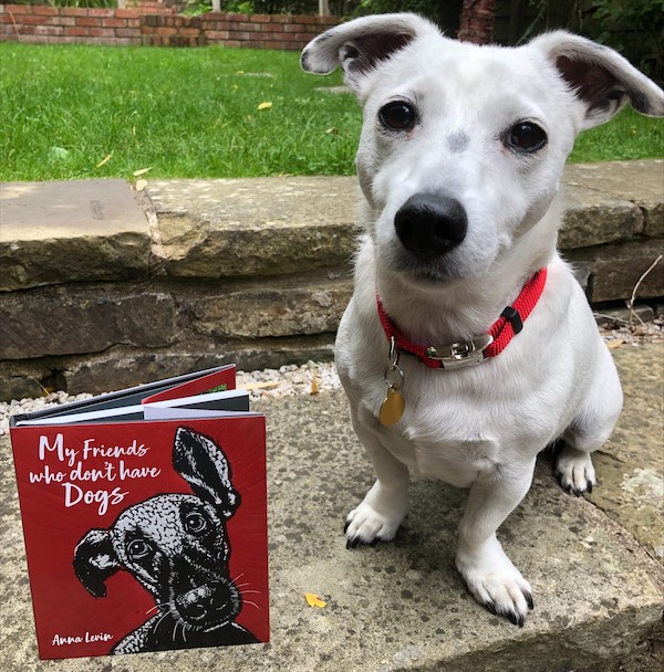 Dog sits by book titled "My Friends Who Don't Have Dogs"