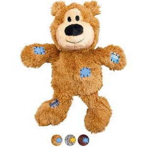 brown plush bear with blue patches