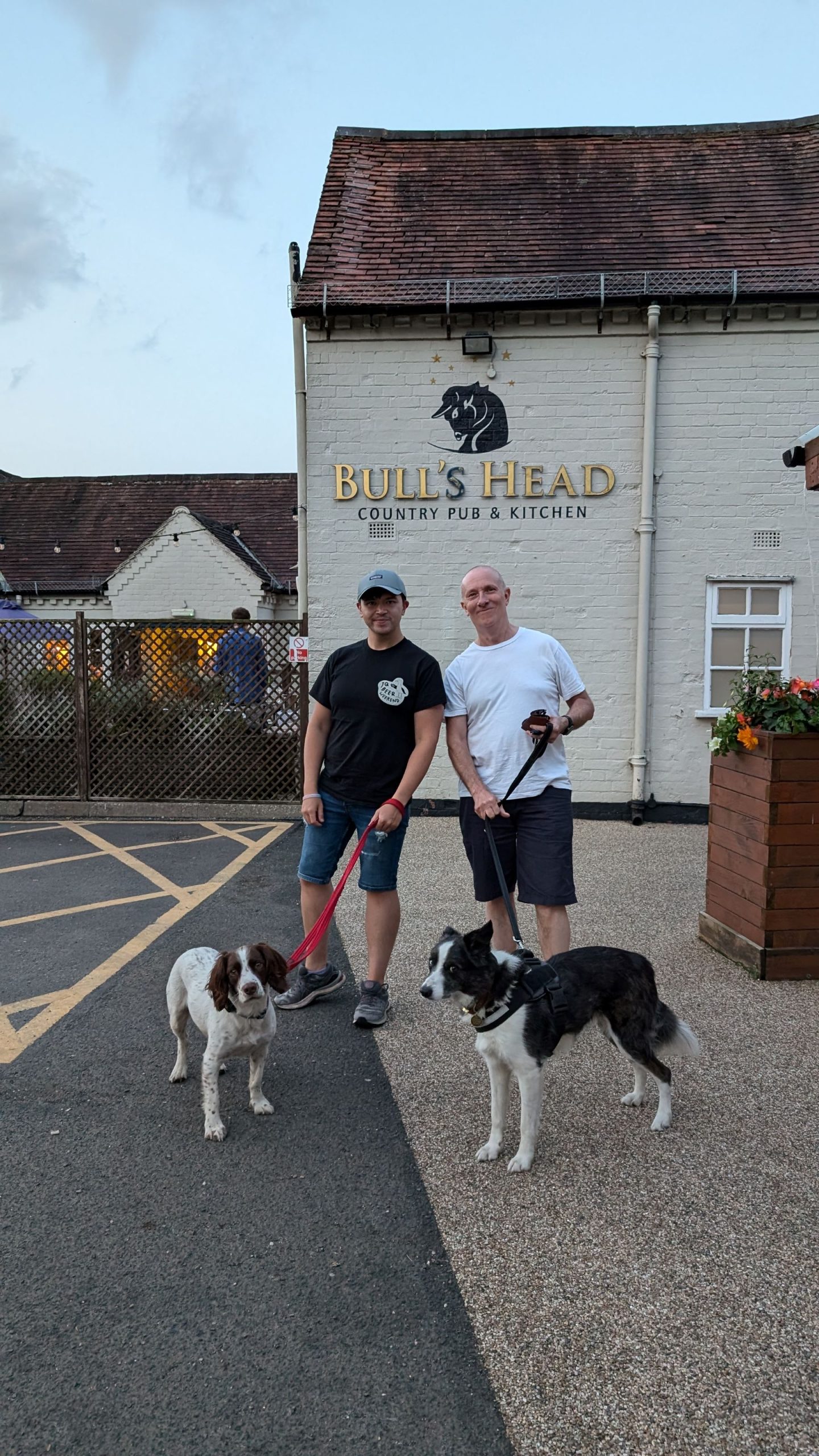 Collie and spaniel and their owners outside The Bull's Head Pub, Earlswood/Solihull