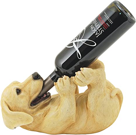 Wine bottle holder sculpted as a puppy on its back holding the bottle in its mouth.