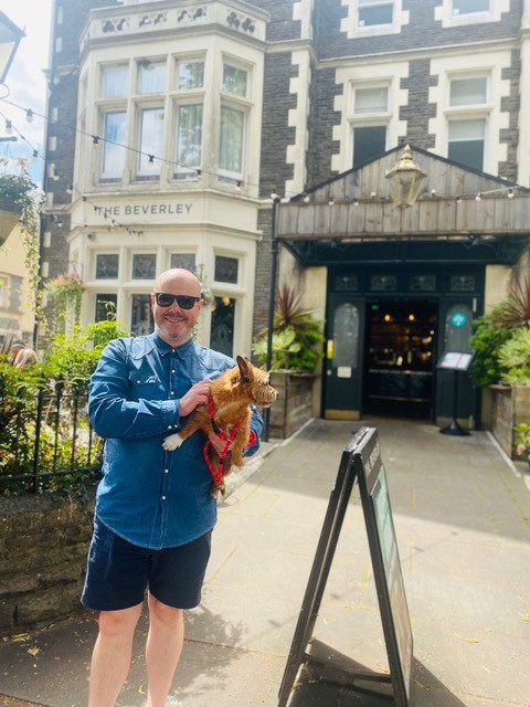Man and his dog outside the Beverley PUb