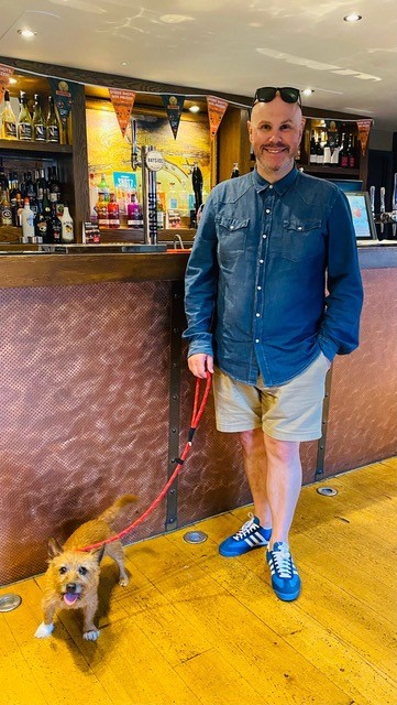 Dog and owner at the Pump House bar