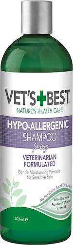 A green, white and purple bottle of dog shampoo.