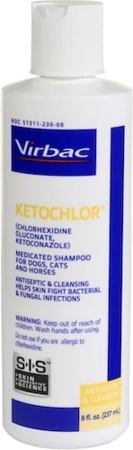 White, blue, and yellow bottle of dog shampoo. 
