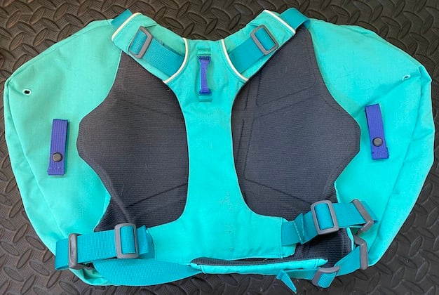 underside of Ruffwear dog pack showing buckles and back padding