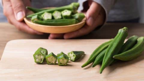 Chopping okra to cook