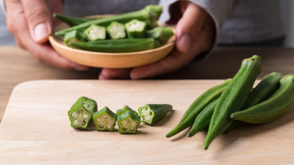 Chopping okra to cook