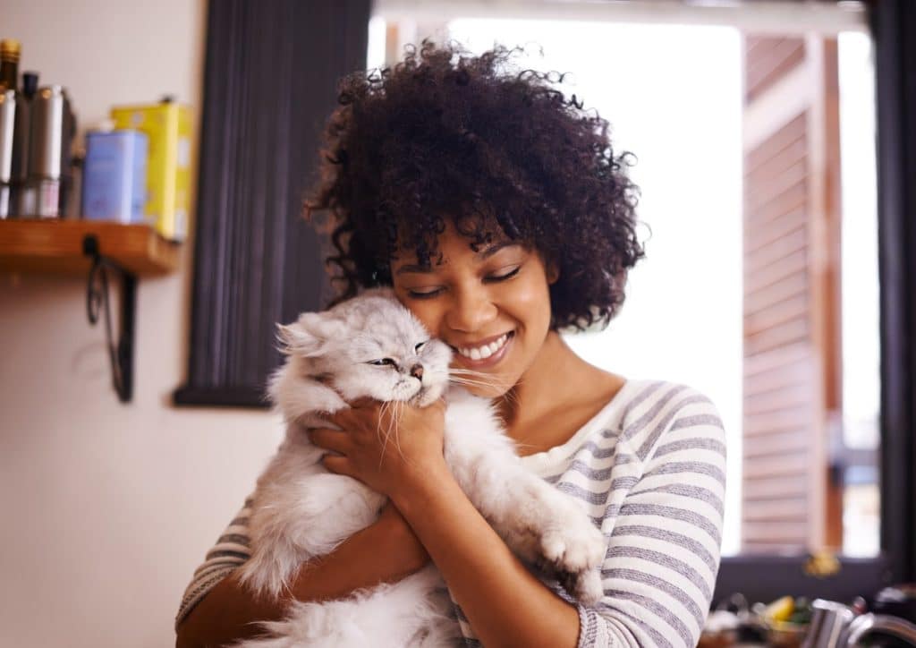 A woman bonding with her cat