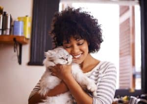 A woman bonding with her cat