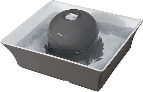 Grey and white ceramic dog water fountain
