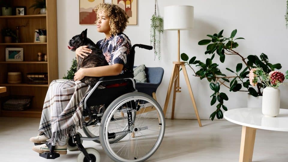 Disabled pet parent with their emotional support dog