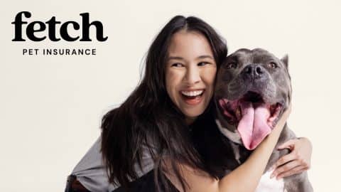 Woman hugging dog below Fetch Insurance logo