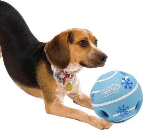 dog bowed playing with Wobble Wag Giggle Holiday Edition Dog Toy ball