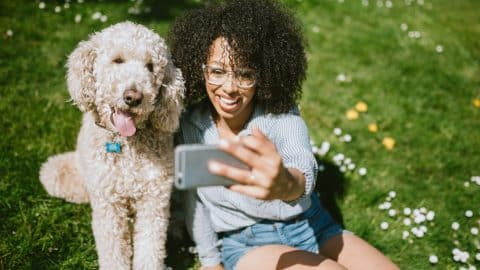 Pet parent making happy memories with their dog