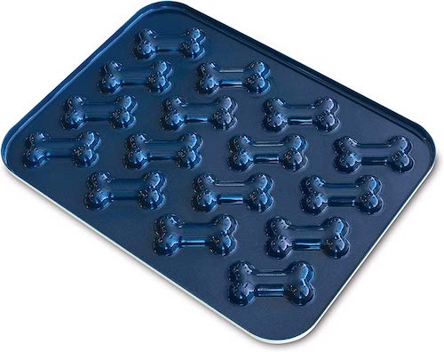 Navy blue metal tray with dog bone molds.