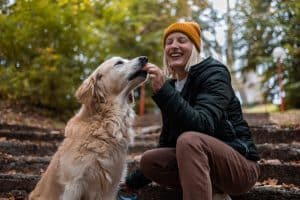 Giving dog treat on walk
