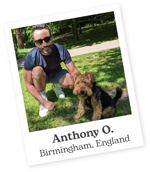 Sitter on Rover in a park with his dog