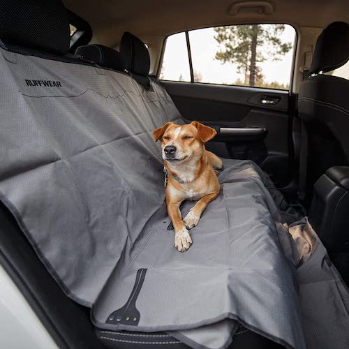 Dog sitting on Ruffwear car seat cover
