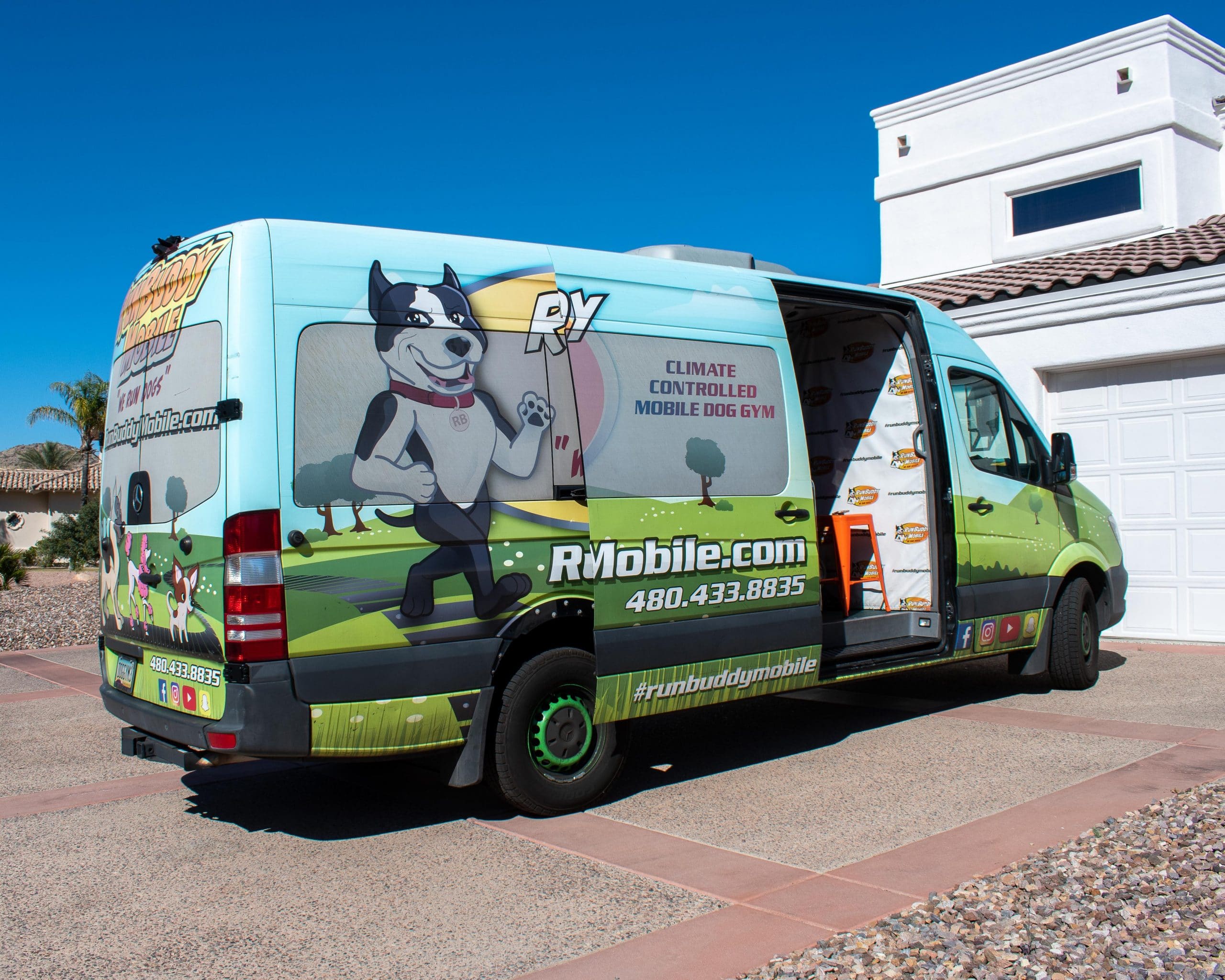 the RunBuddy mobile dog gym van parked and ready for its client.
