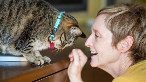 A woman saying her cat's name