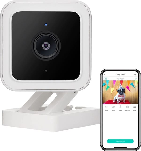 Wyze Pet Camera next to phone displaying app